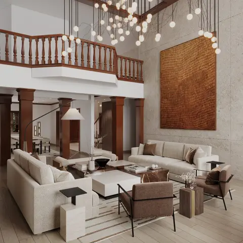 Double-height living room with a cluster of globe pendant lights, a turned-wood mezzanine balcony