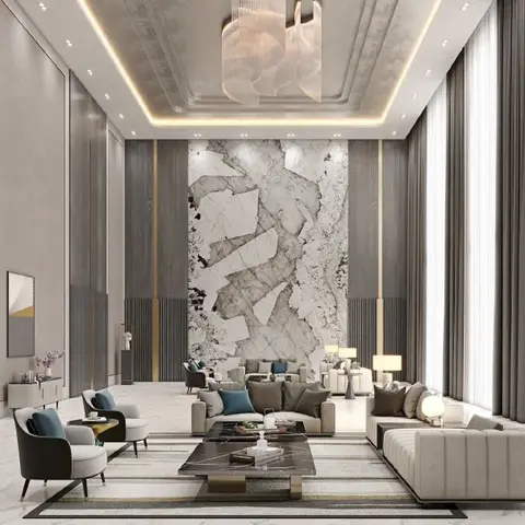 Double-height living room with a dramatic book-matched grey-and-white marble feature wall, a sculptural ribbon chandelier and a gold-trimmed cove ceiling.