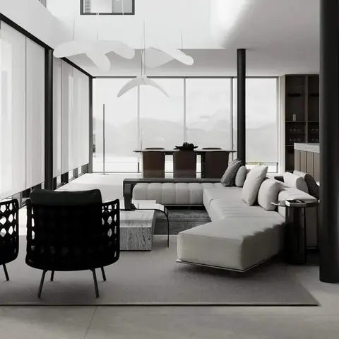 Double-height living room with floor-to-ceiling glazing framing a mountain view, an oatmeal modular sectional sofa