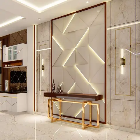 Entrance foyer with a backlit 3D geometric marble-and-panel feature wall, a brass-legged console table styled with ceramic vases, and glossy marble flooring.