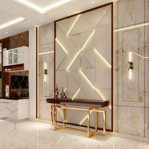 Entrance foyer with a backlit 3D geometric marble panel wall behind a gold-legged console table