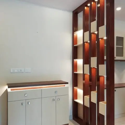 Entrance foyer with a backlit wood slat partition screen with staggered display cubes, and a cream shoe cabinet with an under-lit shelf.