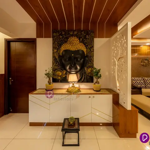 Entrance foyer with a large relief Buddha wall art panel above a gold-and-white console styled with bonsai plants, a wood-slat cove ceiling