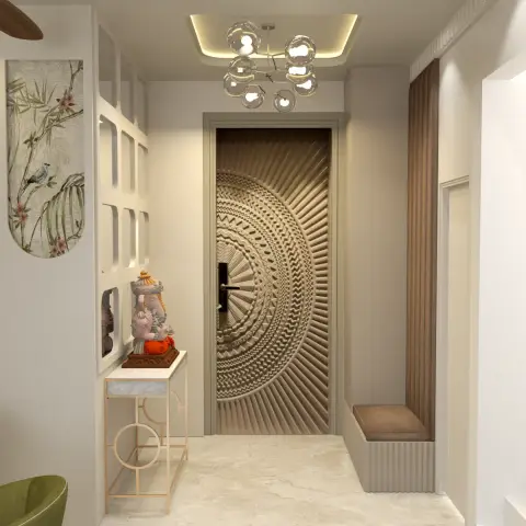Entrance foyer with a sculptural radial-carved main door, a marble-topped gold console table holding a Ganesh idol