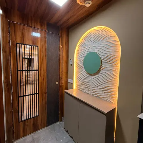 Entrance foyer with a wood-clad ceiling and main door fitted with a black safety grille