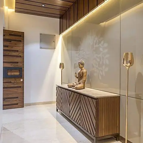 Entrance foyer with a wood-slat ceiling, a chevron-pattern wood console styled with a brass Buddha statue and matching brass floor lamps