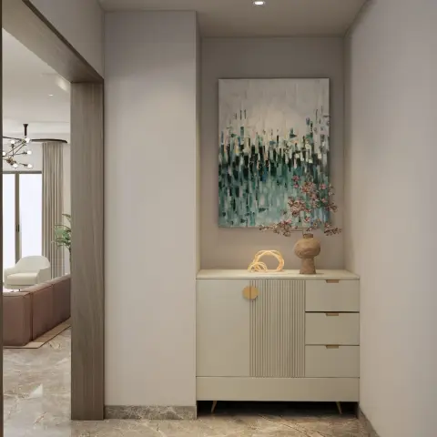 Entry vestibule with a cream fluted-front shoe console on tapered brass legs under a teal abstract canvas