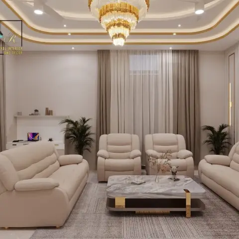 Four-piece beige leatherette recliner set faces a marble-top coffee table with gold blade legs