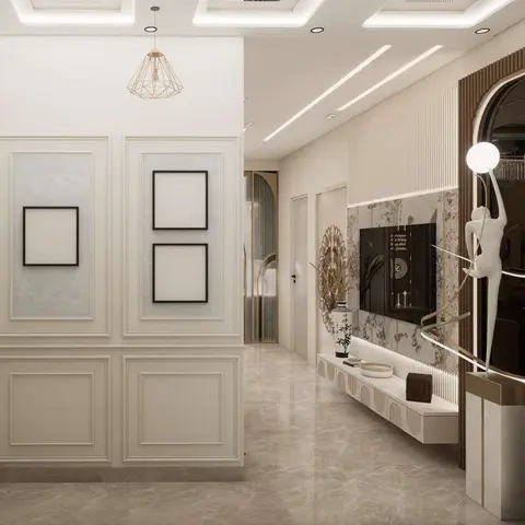 Foyer with panelled wainscoting and a gold cage pendant opening into a living room with a fluted marble TV feature wall