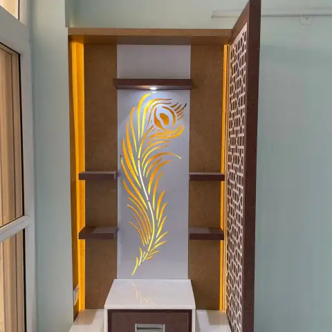 Freestanding pooja unit with a backlit peacock-feather cut-out on a white acrylic panel, four dark wooden ledges against a rust-textured back
