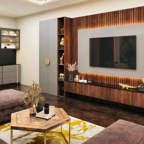 Full-wall walnut fluted TV panel with a backlit grey recess, facing mauve fabric sofas over a mustard-splashed rug and a hexagonal inlay coffee table
