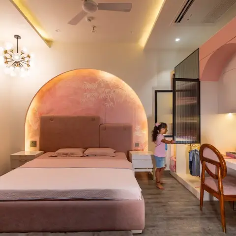 Girl's bedroom in dusty pink with a backlit arched botanical mural behind the upholstered bed, a bubble sputnik light on the side wall