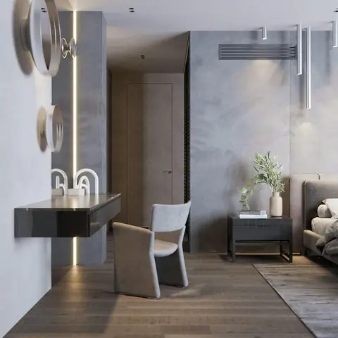 Grey concrete-textured bedroom with an adjoining open dressing nook and round wall mirrors