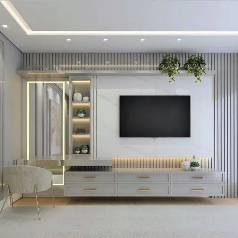 Grey fluted-panel TV wall with a marble backsplash, gold-lit mirror niche, and hanging plants above open shelving.
