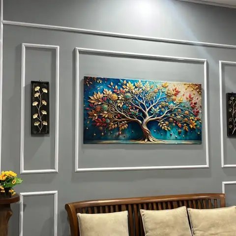 Grey moulded feature wall with a large tree-motif wall art panel above a wooden slatted sofa with cream cushions.