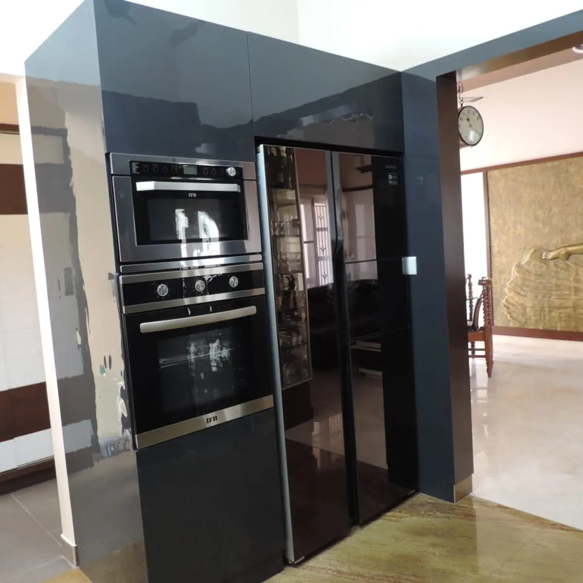 black and white modern minimalist kitchen with tall unit — real Indian home