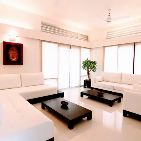 black and white modern minimalist living room with cove — real Indian home