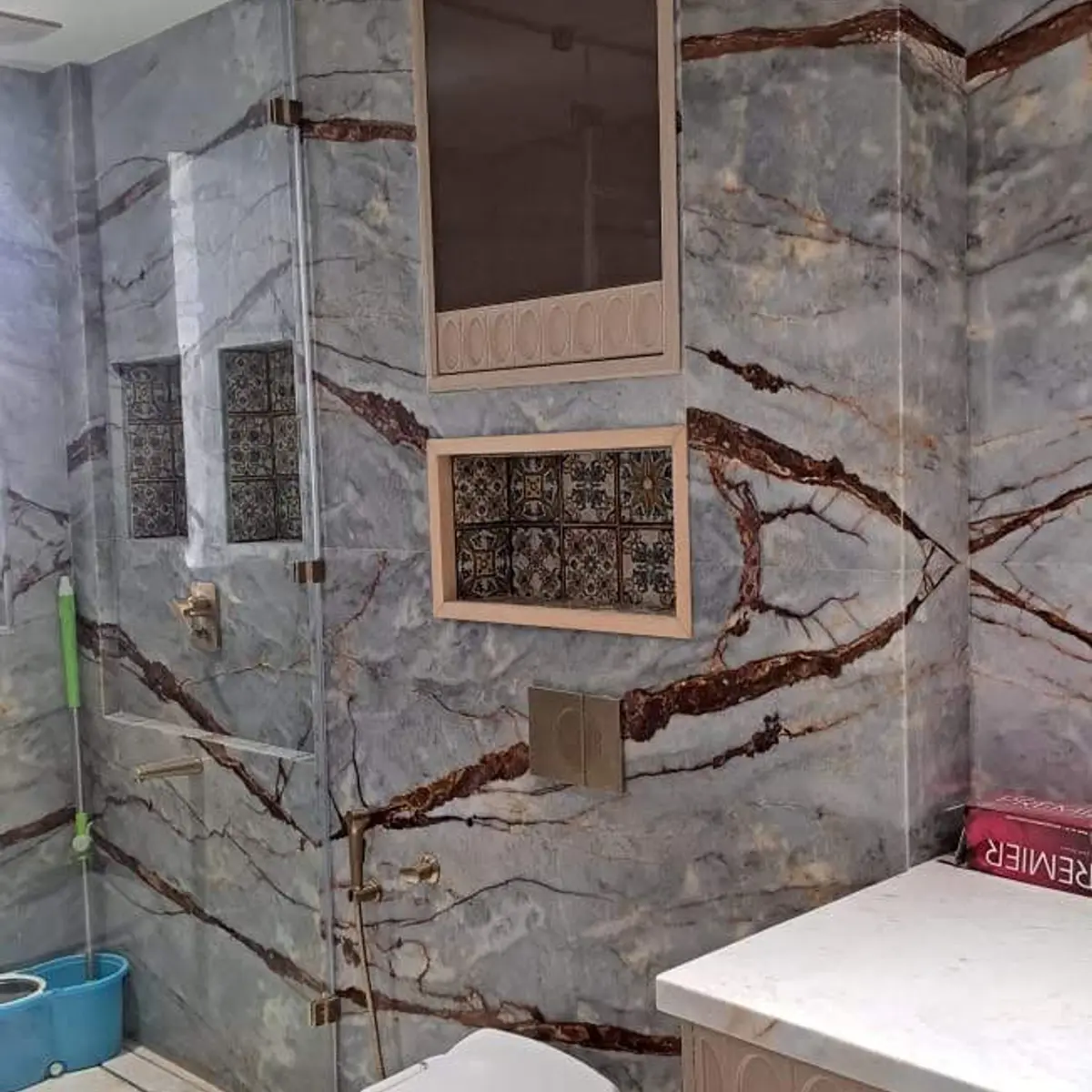 jewel tone luxury bathroom with cladding — real Indian home