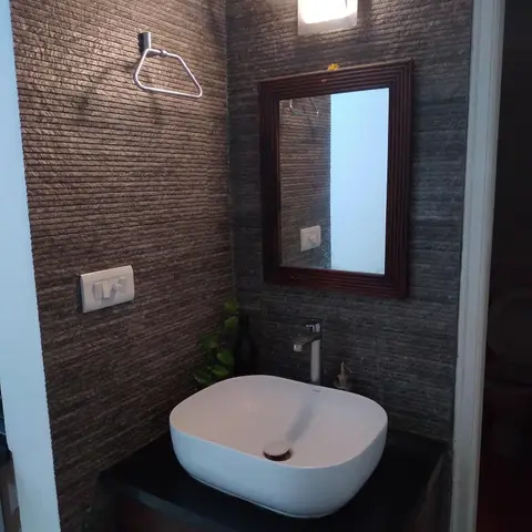 earthy modern indian bathroom with vanity — real Indian home