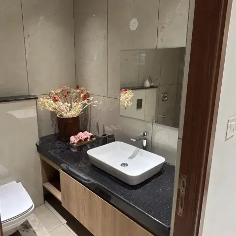 earthy modern minimalist bathroom with vanity — real Indian home