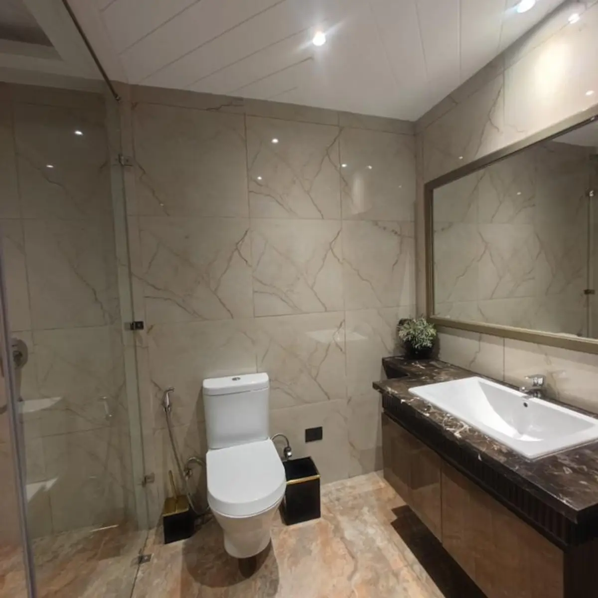 beige modern indian bathroom with tiles — real Indian home