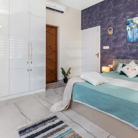 jewel tone modern indian master bedroom with wardrobe — real Indian home