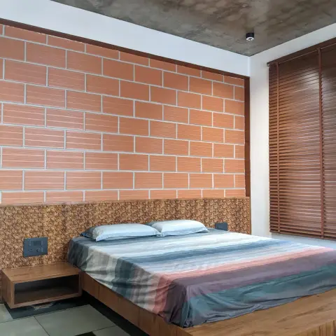earthy industrial master bedroom with cladding — real Indian home