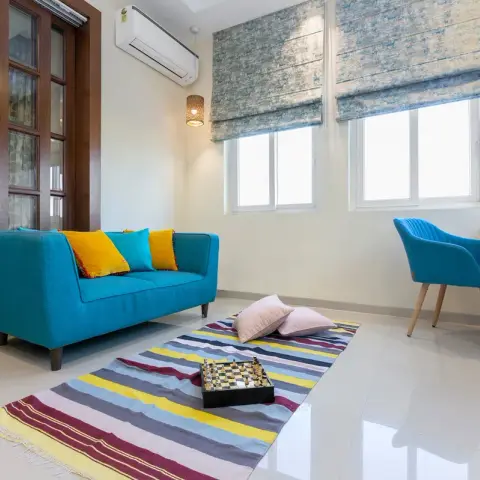 bold colour living room with seating — real Indian home