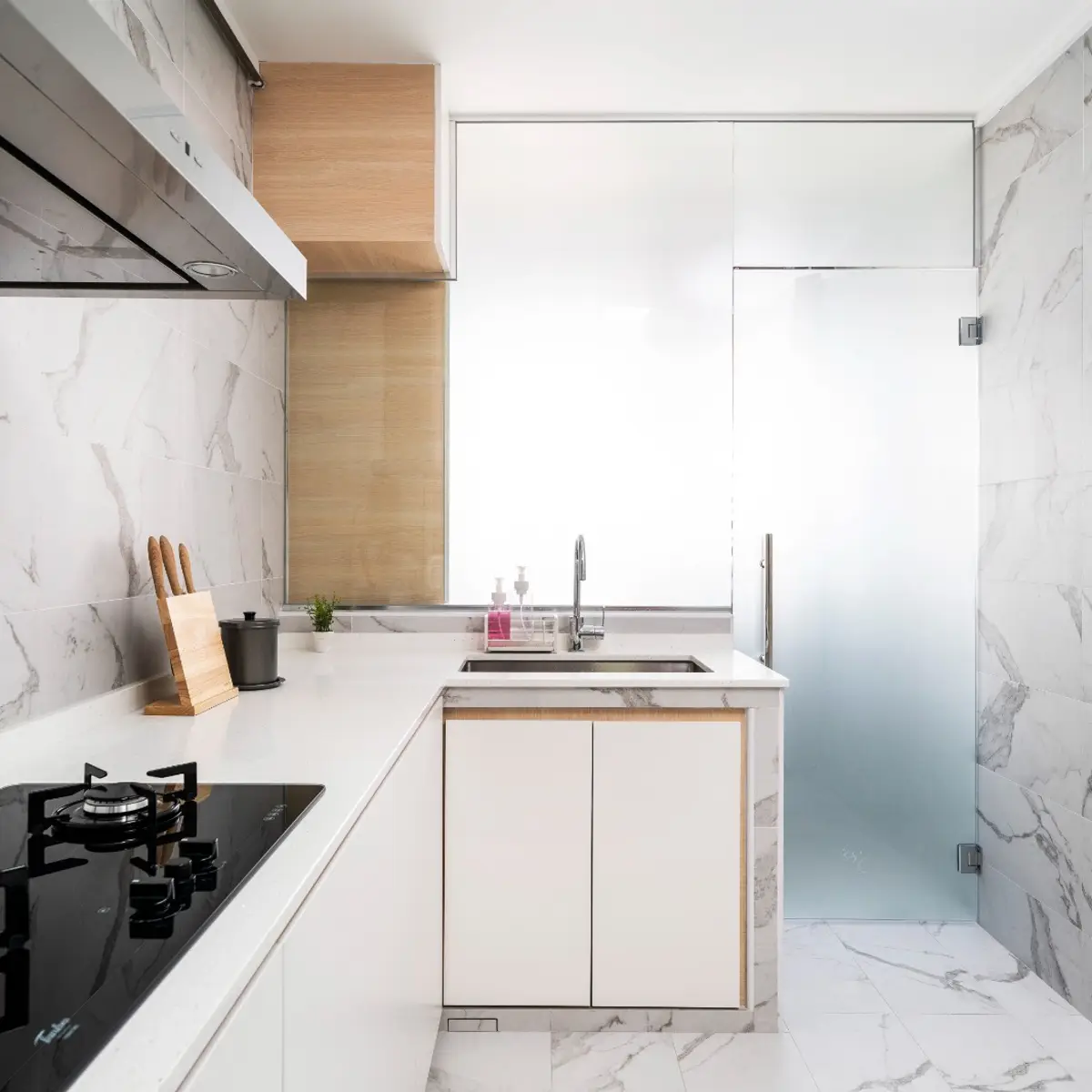black and white modern minimalist kitchen with shutter — real Indian home
