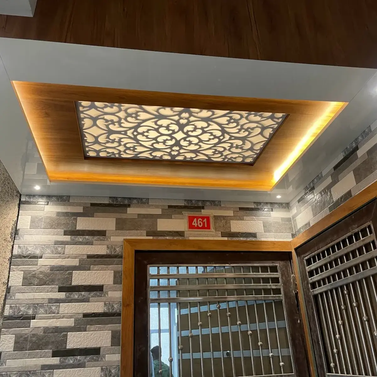 beige entrance foyer with cove — real Indian home