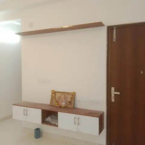 beige living room with tv unit — real Indian home