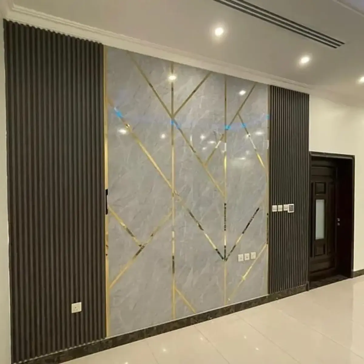 grey luxury entrance foyer with cladding — real Indian home