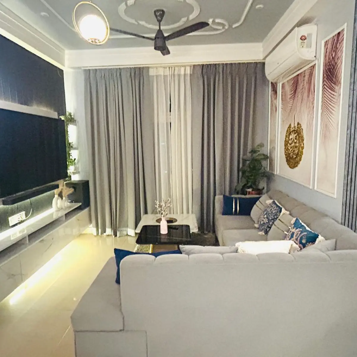 grey modern indian living room with tv unit — real Indian home