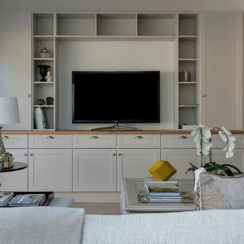 beige traditional living room with tv unit — real Indian home