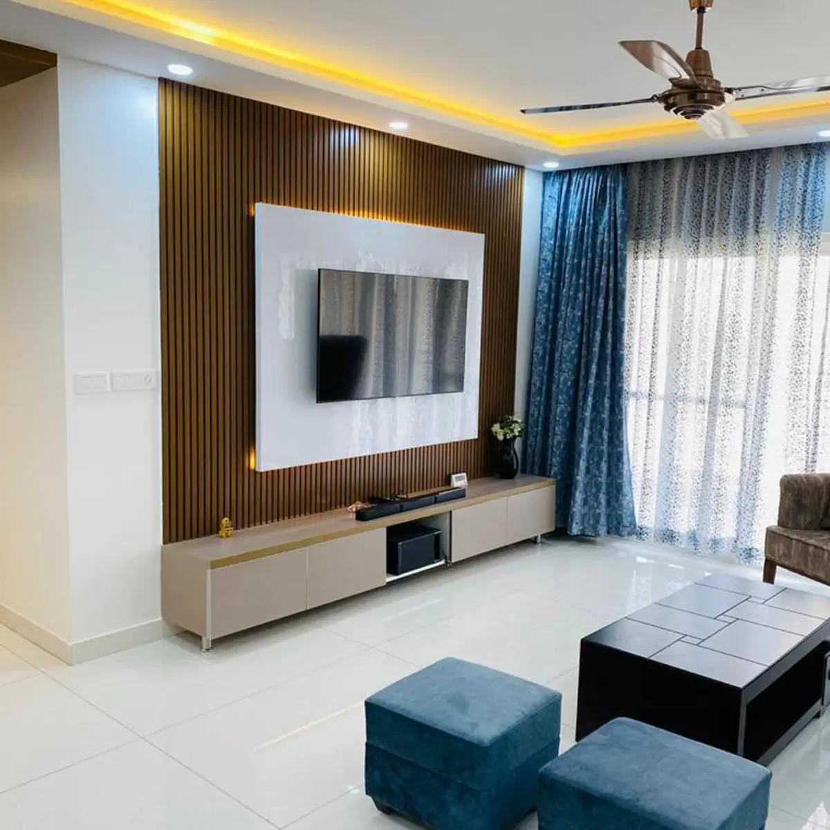grey modern indian living room with panelling — real Indian home