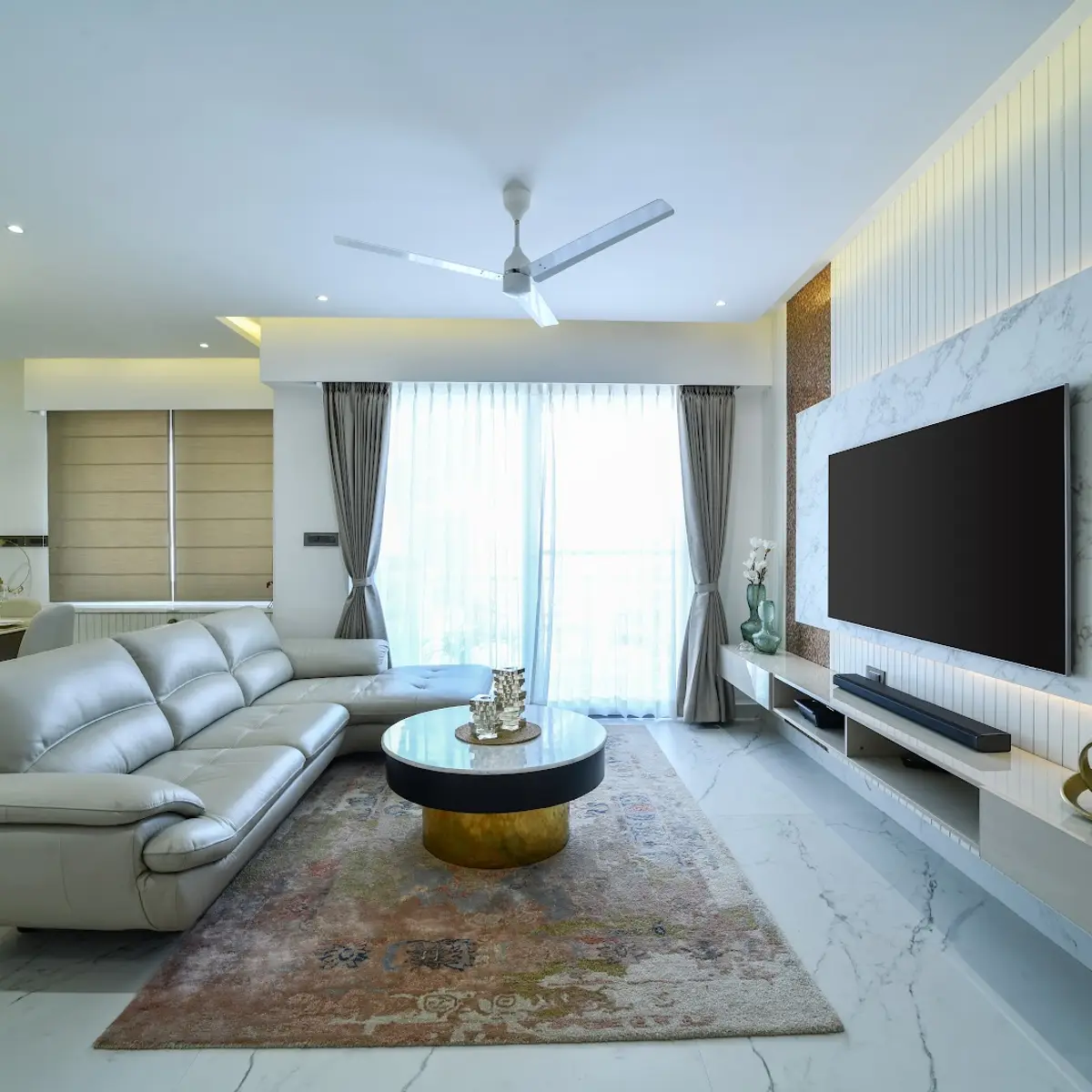 black and white modern minimalist living room with tv unit — real Indian home