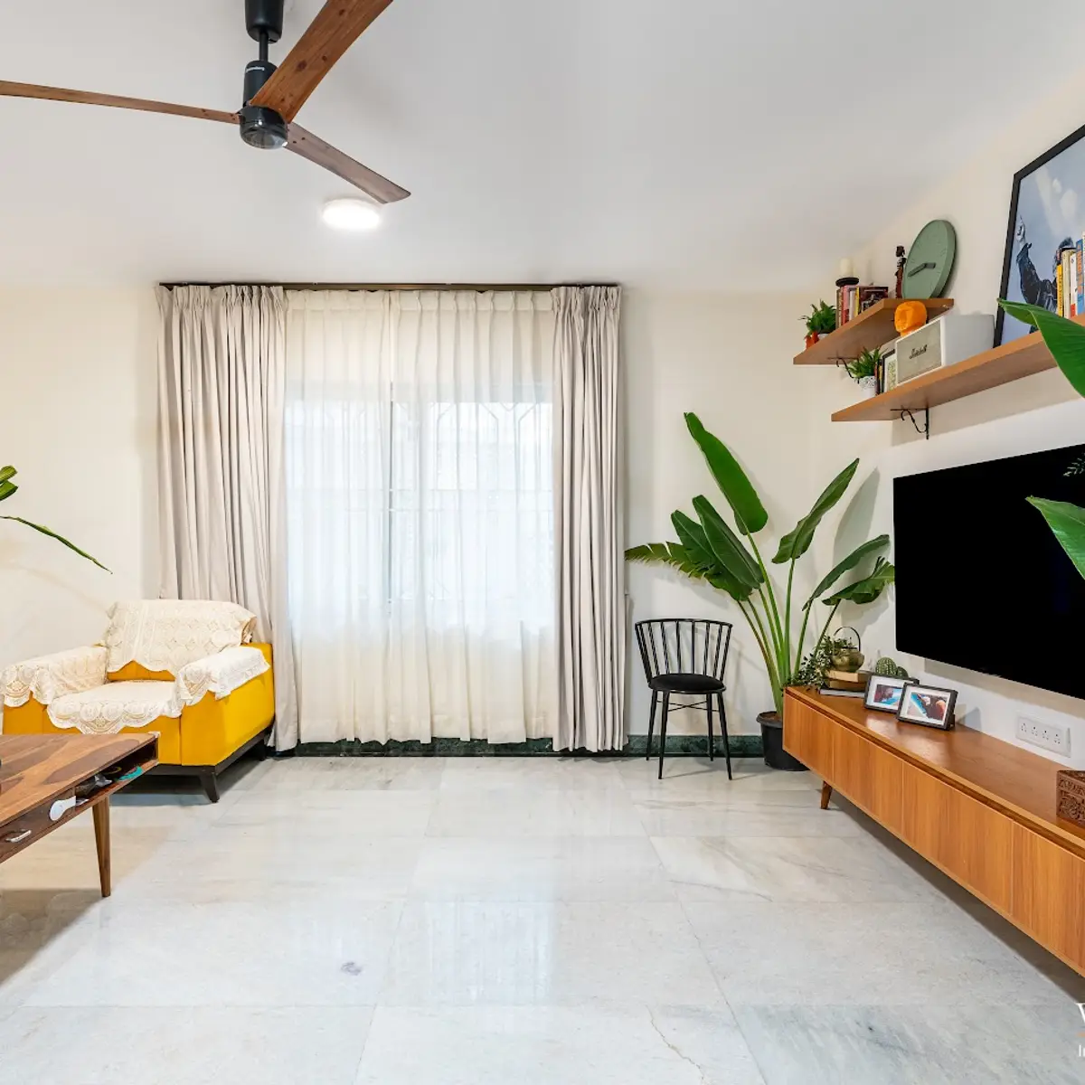 bold colour mid century living room with tv unit — real Indian home