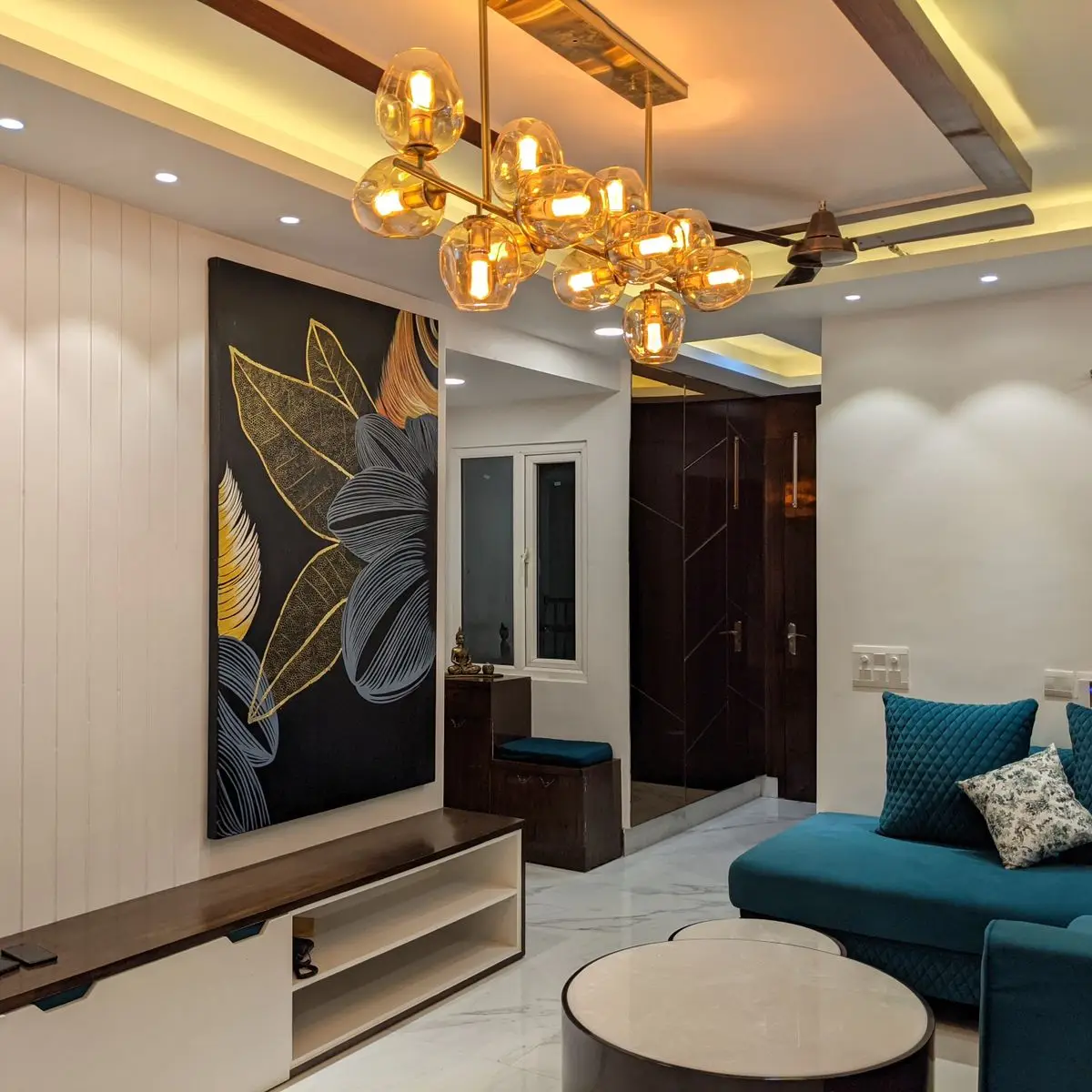 jewel tone modern indian living room with panelling — real Indian home