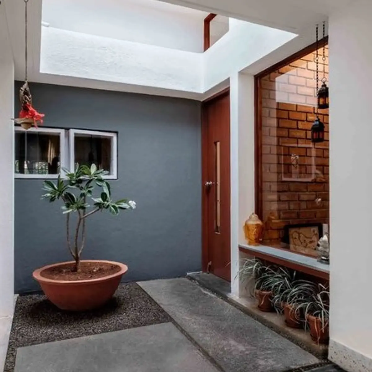 earthy modern indian entrance foyer with jaali — real Indian home