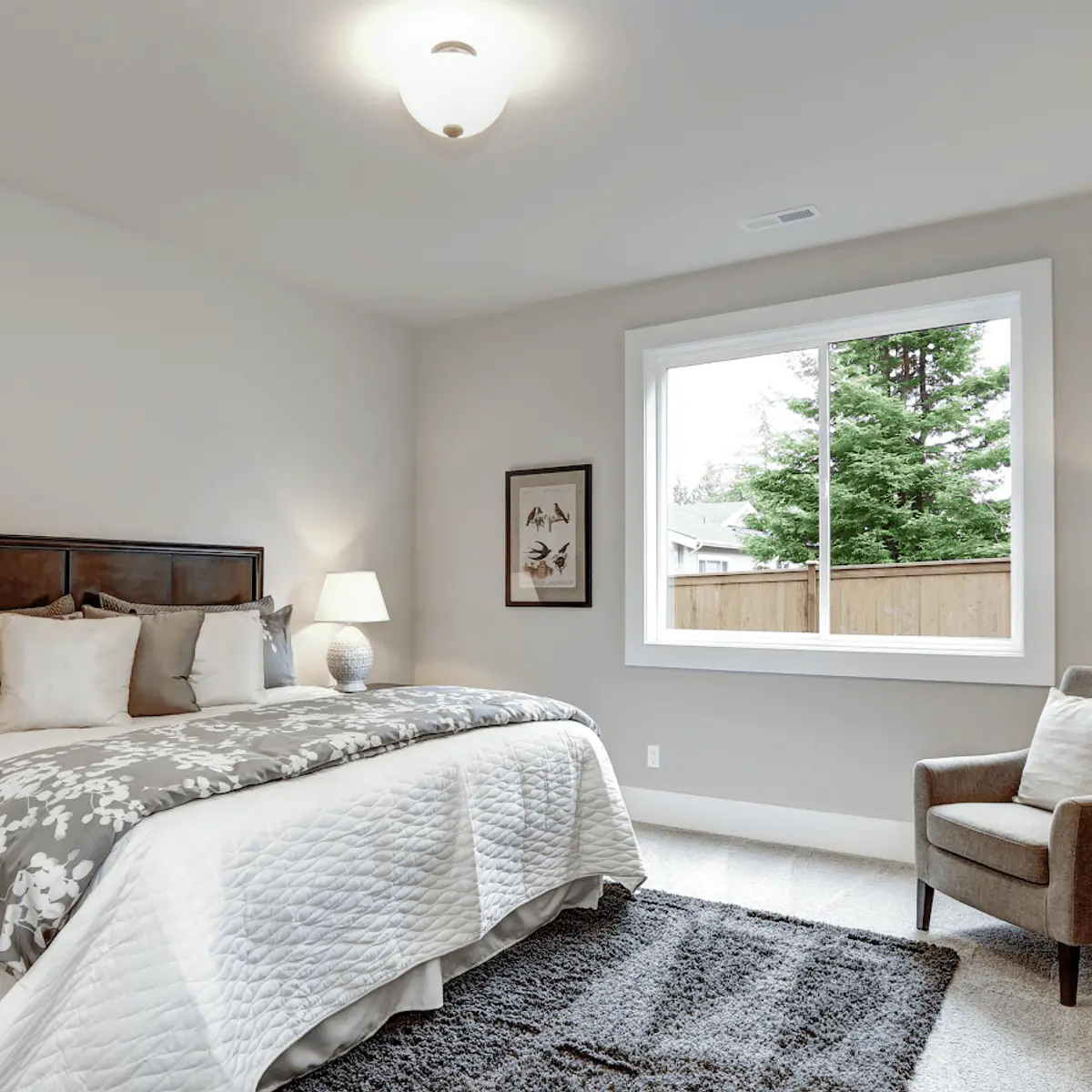 beige traditional master bedroom with rug — real Indian home