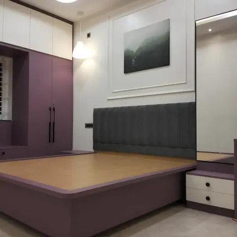 Handover photo of a bedroom with a built-in mauve laminate bed platform still without its mattress