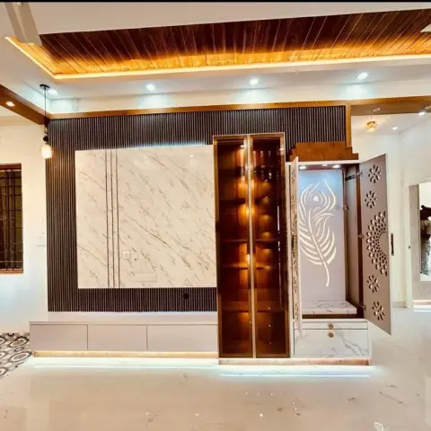 Handover photo of a living-room feature wall combining a white marble slab TV panel set in dark fluted panelling
