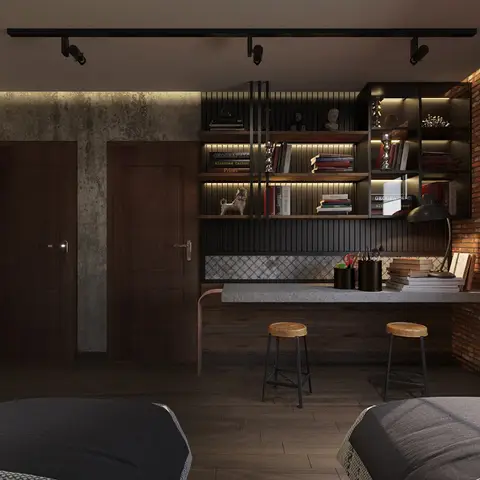 Industrial-style study nook with a brick accent wall, black metal shelving with integrated lighting, and a wood bar-height desk with two stools.