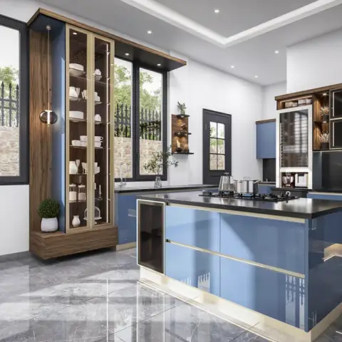 Island kitchen in glossy blue cabinetry with brass trim, black granite counters and a glass-front crockery tower by the window.