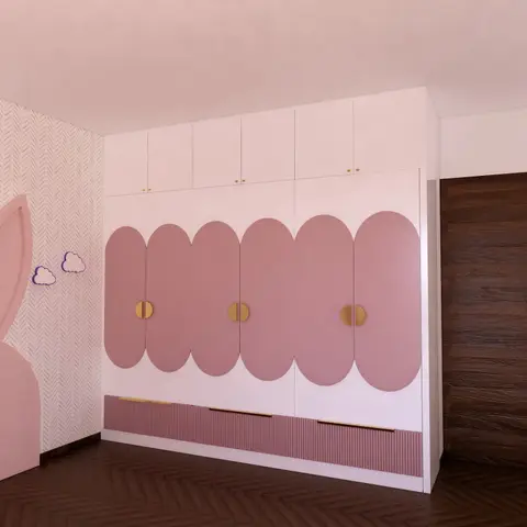 Kids' bedroom wardrobe wall with scalloped dusty-pink cloud-shaped door fronts and brass half-moon handles