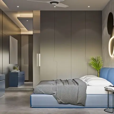 Kids bedroom with a blue upholstered bed, a Mickey Mouse-shaped LED wall light and a full-height grey wardrobe wall
