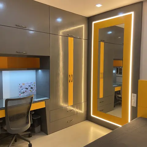 Kids' bedroom with a grey and mustard-yellow wardrobe and backlit full-length mirror, paired with a built-in study desk and matching yellow headboard.