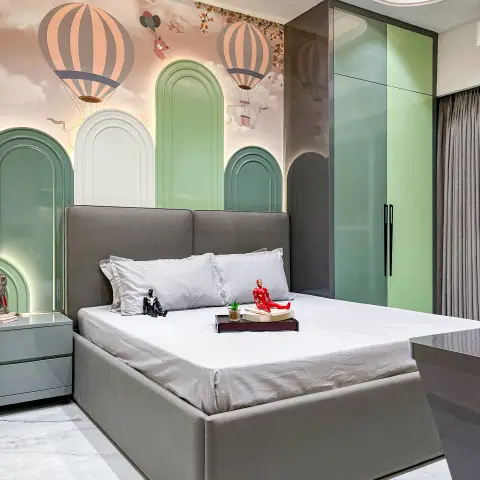 Kids' bedroom with a hot-air-balloon mural on backlit arched wall panels and a glossy sage-green wardrobe