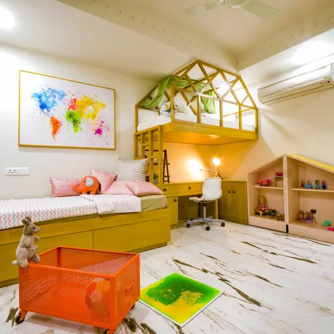 Kids' bedroom with a mustard-yellow storage bed, a house-frame loft structure over a built-in study desk, and a colorful splash-art world map on the wall.