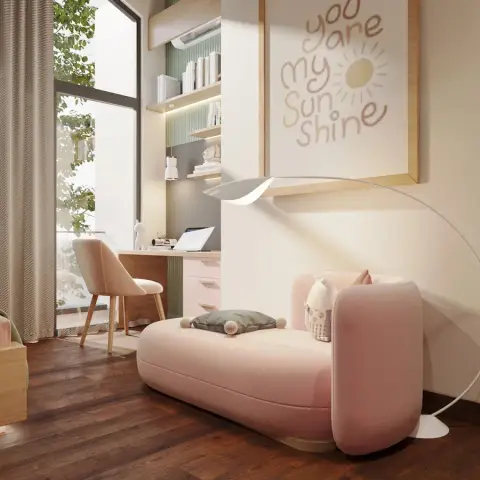 Kids' bedroom with a pink upholstered chaise lounger, a built-in study desk with pastel-pink drawers and floating shelves